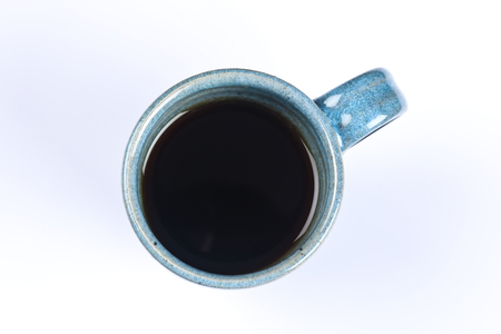 blue design mug of tea and coffee on a white backgroundの写真素材