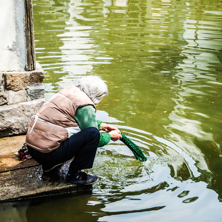 ZHOUZHUANG, SHANGHAI - April 11, 2011 : Zhouzhuang, the ancient water village is Shanghai tourist attraction with 1,000,000 visitors per year and there are a lot of variety activities have done here.のeditorial素材
