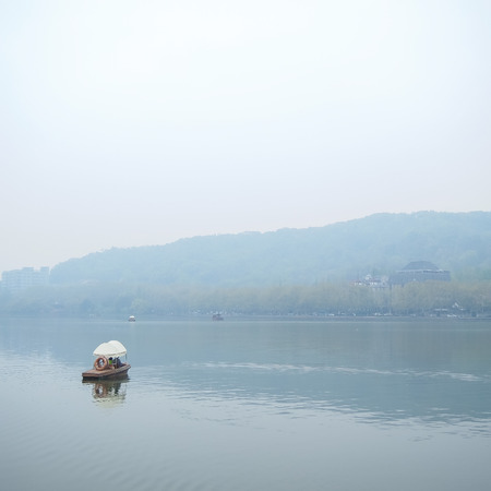 HANGZHOU, CHINA - April 13, 2011 : View in the mist of Xihu, the west lake in hangzhou china, Cruise in the Lakeのeditorial素材