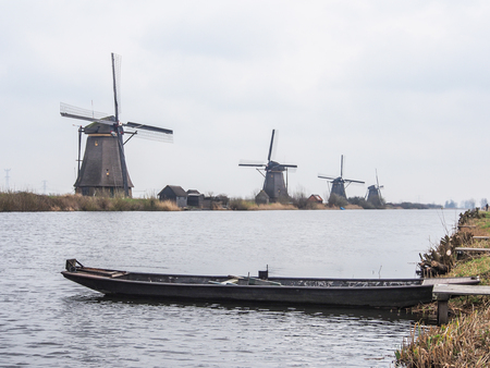 Netherlands rural landscape with windmills and canal at famous tourist site Kinderdijk in Hollandの写真素材