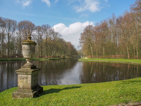 Stone fountain by the beautiful pond in the park of Kasteel De Haar, The Natherlandsの写真素材