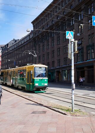 HELSINKI, FINLAND - JULY 17, 2015: The movement of the tram on streets of Helsinkiのeditorial素材