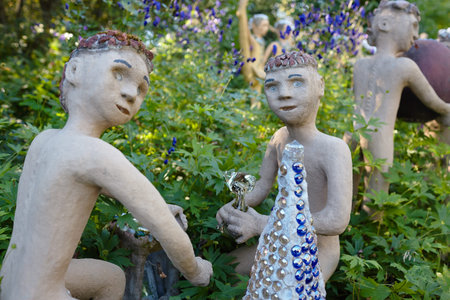 Parikkala, Finland - August 21, 2015: Sculptures by ITE-artist Veijo Ronkkonen in his sculpture park Parikkalan patsaspuisto . The park contains about 560 concrete statues and a magnificent garden.のeditorial素材