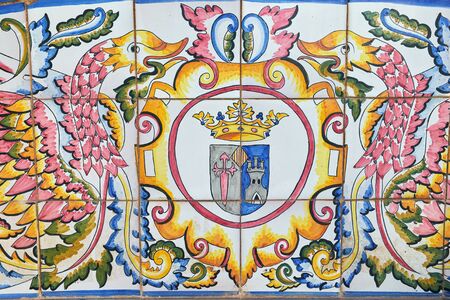 Algorfa, Spain - July 3, 2016: Decorative ceramic tiled bench in the Algorfa. Province Alicante, Spain. Golf course. Part of the picture, coat of arms Algorfa.のeditorial素材