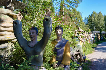 Parikkala, Finland - August 21, 2015: Sculptures by ITE-artist Veijo Ronkkonen in his sculpture park Parikkalan patsaspuisto . The park contains about 560 concrete statues and a magnificent garden.のeditorial素材