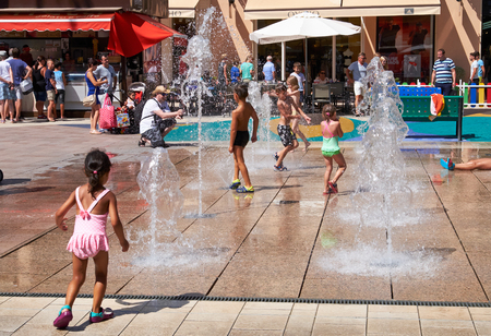 Orihuela, Spain - June 27, 2016: La Zenia Boulevard shopping centre. La Zenia Boulevard is the largest Shopping centre in the province of Alicante. Kids playing in water fountainsのeditorial素材