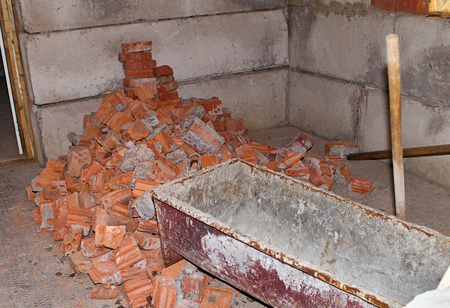 Pile of Bricks by an Old Brick Wall taken by an old building in St. Petersburg. Building trough for concrete.の写真素材