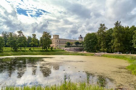 View of the Gatchina Palace from the side of the Palace Park, next to Karpin pond in autumn. St.Petersburgの写真素材