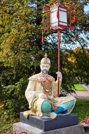 Statue on Chinese Grand Bridge 1785, it is reconstructed in 1860 in Alexander Park, Tsarskoye Selo, Pushkin, Saint Petersburg, Russia.の写真素材