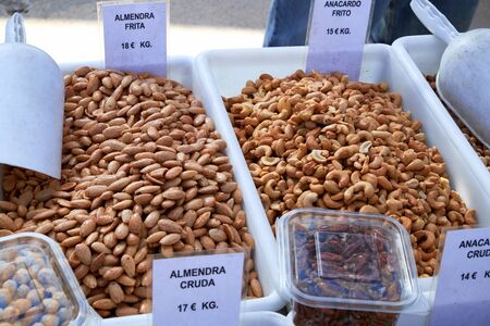 Different types of delicious nuts for sale at Sunday market in Spain, Mercadillo de Campo de Guardamarの写真素材