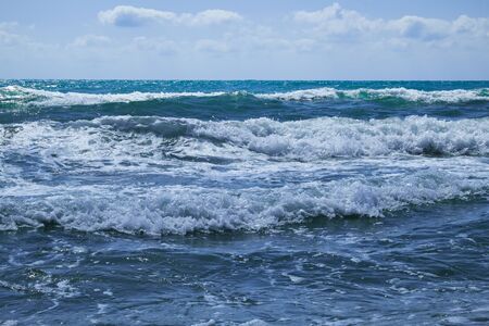 The Mediterranean Sea with raging waves on a summer sunny day. Valencia, Alicante, Spain.eanの写真素材