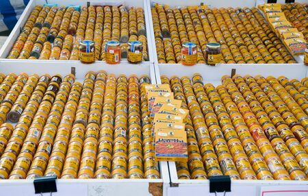 El Raso, Alicante, Spain - July 2, 2016: A variety of spices and spices in yellow glass bottles. Sunday market in Spain, Mercadillo de Campo de Guardamar.のeditorial素材