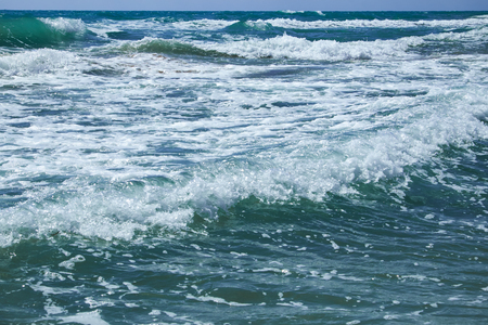 The Mediterranean Sea with raging waves on a summer sunny day. Valencia, Alicante, Spain.eanの写真素材