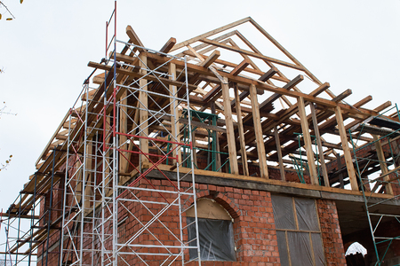 Building Attic Interior. Wooden Roof Frame House Construction. Roofing Construction Indoor.の写真素材