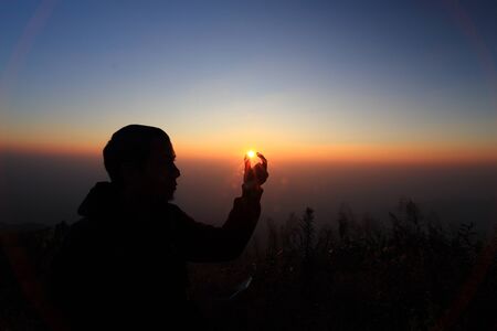 Man on top of mountainの写真素材