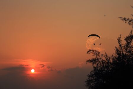 Paramotor and sunsetの写真素材