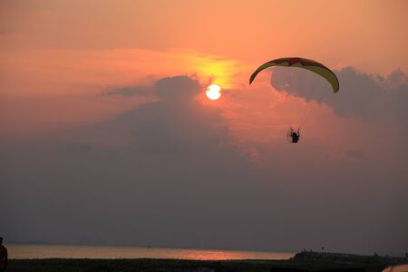 Paramotor and sunsetの写真素材