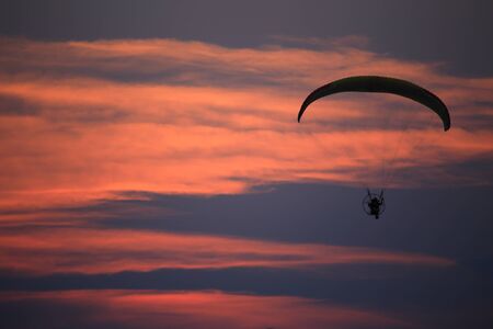 Paramotor and sunsetの写真素材