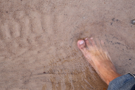 feet on the sandの写真素材