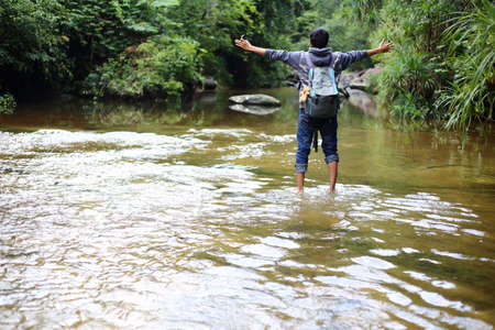 man and waterfallの写真素材
