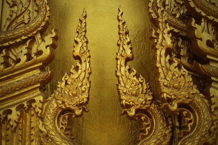 gold color wall of Wat Pak Nam Jolo in Chachoengsao at Thailand.の写真素材