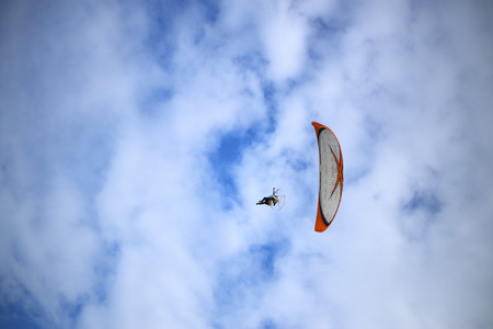 Paramotor flying in the skyの写真素材