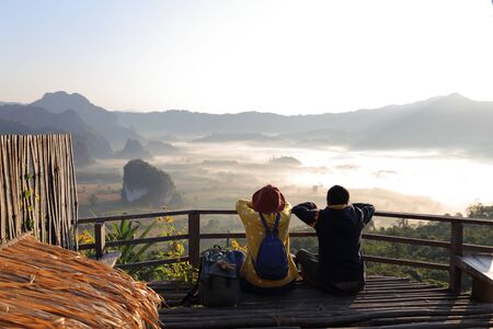 Women and men enjoy the view of Phu Lanka in the morning in Phayao, Thailandの写真素材