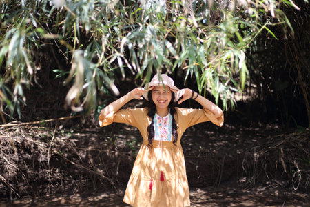 A woman standing in a bamboo grove