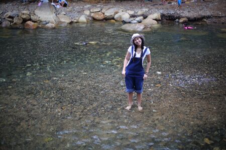 Women playing in fun at Khlong Phaibun Waterfall, Chanthaburi, Thailandの写真素材