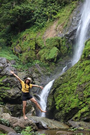 Women enjoying nature at Klong Lan waterfall in Klong Lan national park at Kamphaeng Phet, Thailandの写真素材