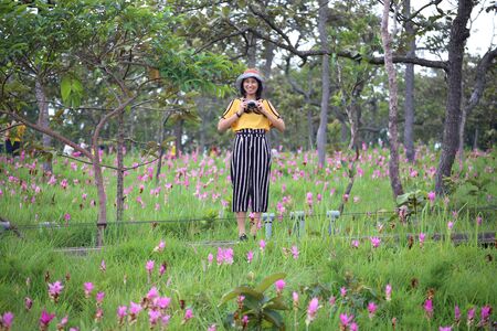 Women in the fields of Krachiew flowers at Pa Hin Ngam National Park in Chaiyaphum, Thailandの写真素材