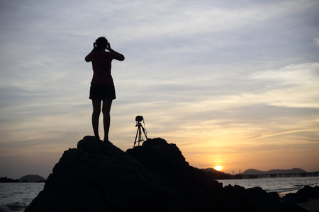Women wait photography sunset at the beach