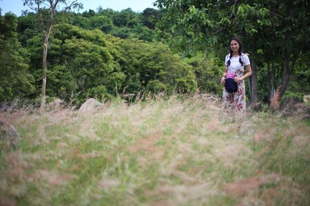 A woman standing in the meadowの写真素材