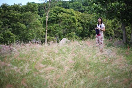 A woman standing in the meadowの写真素材