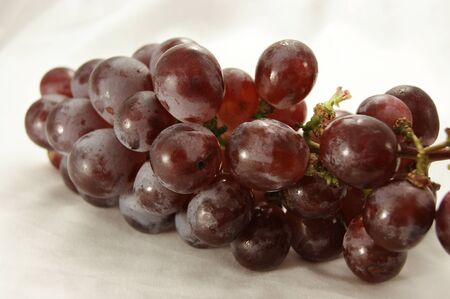 Sweet, juicy red grapes to eat, vitamins and minerals.の写真素材