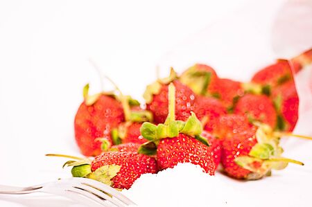 strawberry And sugar with a fork.Healthy food.の写真素材