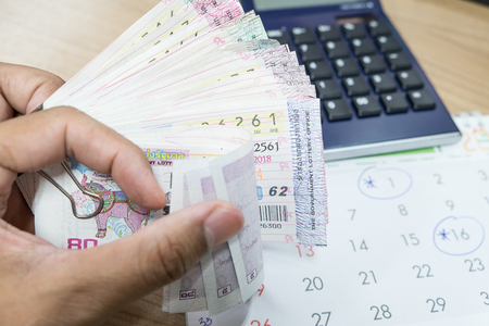 Close up Thai lottery tickets with business backgroundの写真素材