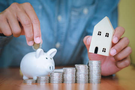 The man is handing out a white mobile phone screen to the front. Text can be placed in copy spaces. Concept of technology, Social and communicationの写真素材