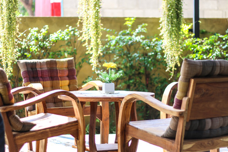 old wooden table and chairs outdoors coffee shopの写真素材