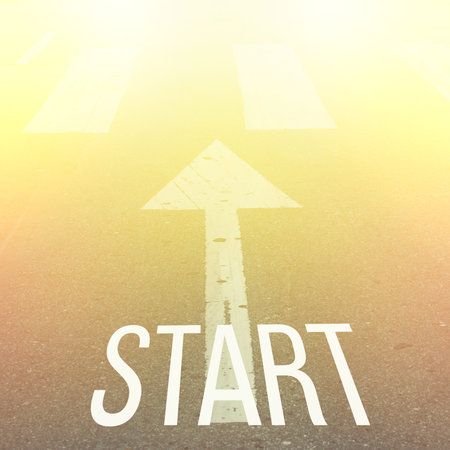 Inspirational Typographic Quote - Start. on a road background with vintage filter
