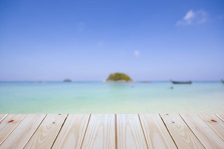 empty plywood and blur beach background can be used for product display templateの写真素材