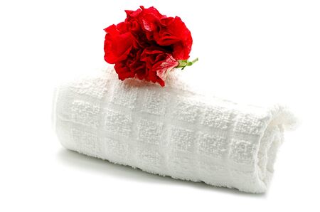 Beautiful red Hibiscus flower with towel on spa themeの写真素材