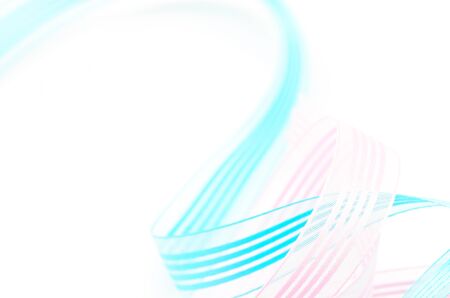Beautiful fabric blue and pink ribbon, isolated on a white backgroundの写真素材
