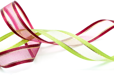 Beautiful brown and green gift ribbon, isolated on a white backgroundの写真素材