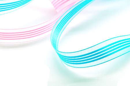 Blue and pink ribbon, isolated on a white backgroundの写真素材