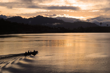 Sunrise sky with the boat on the river, Thailand