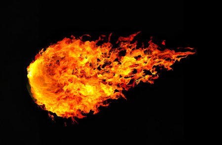 Fire flames on a black background as a concept of danger or heatの素材