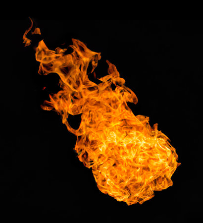Fire flames on a black background as a concept of danger or heatの素材