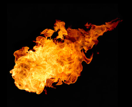 Fire flames on a black background as a concept of danger or heatの素材