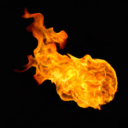 Fire flames on a black background as a concept of danger or heatの素材
